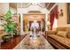 Elegant living room featuring high ceilings, ornate details, and a view of the formal dining area, perfect for gatherings at 10798 Tapestry Winds St, Las Vegas, NV 89141