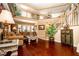 Spacious living room featuring hardwood floors, staircase, and natural lighting at 10798 Tapestry Winds St, Las Vegas, NV 89141