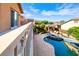 Upper View of Backyard oasis featuring a luxurious pool, spa, and lush greenery at 10798 Tapestry Winds St, Las Vegas, NV 89141