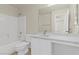 Bright bathroom featuring a tub-shower, white vanity, and neutral wall color at 11076 Zampino St, Las Vegas, NV 89141
