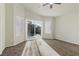 Bright bedroom featuring carpet, sliding glass doors leading to a pool, and natural light at 11076 Zampino St, Las Vegas, NV 89141