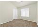 Bedroom featuring carpet flooring, closet with sliding doors, and window at 11076 Zampino St, Las Vegas, NV 89141