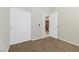 Bedroom featuring carpet flooring, closet with sliding doors, and an open door at 11076 Zampino St, Las Vegas, NV 89141