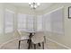 Well-lit dining area featuring tile flooring and large bright windows offering lots of natural light at 11076 Zampino St, Las Vegas, NV 89141