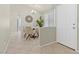 Dining room with chandelier, tile flooring and decorative wall art at 11076 Zampino St, Las Vegas, NV 89141