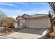 Inviting single-Gathering home featuring a well-maintained front yard and attached garage at 11076 Zampino St, Las Vegas, NV 89141