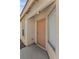 Inviting front entrance featuring a neutral-colored door and modern exterior lighting at 11076 Zampino St, Las Vegas, NV 89141