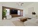 Open living room with modern decor, tile flooring, and ample natural light at 11076 Zampino St, Las Vegas, NV 89141