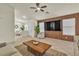 Inviting living room with modern decor, tile flooring, and ample natural light at 11076 Zampino St, Las Vegas, NV 89141