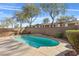 An inviting in-ground pool surrounded by a patio and low maintenance landscaping at 11076 Zampino St, Las Vegas, NV 89141