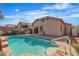 Refreshing in-ground pool, patio area with lush landscape in a backyard at 11076 Zampino St, Las Vegas, NV 89141
