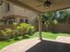 Inviting backyard with a covered patio, lush lawn and brick accents at 11298 Corsica Mist Ave, Las Vegas, NV 89135