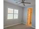 Bedroom with carpet flooring, neutral colors, shuttered windows, and ceiling fan at 11298 Corsica Mist Ave, Las Vegas, NV 89135