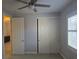 Bedroom with carpet flooring, neutral colors, sliding door closet, and ceiling fan at 11298 Corsica Mist Ave, Las Vegas, NV 89135