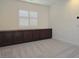 Cozy bedroom featuring a window with wooden shutters and built-in storage at 11298 Corsica Mist Ave, Las Vegas, NV 89135