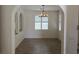 Bright dining room featuring tile floors, shuttered windows, and a chandelier at 11298 Corsica Mist Ave, Las Vegas, NV 89135