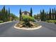 Well-maintained community entrance with mature trees and landscaping at 11298 Corsica Mist Ave, Las Vegas, NV 89135