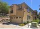 Two-story home with a neutral color scheme, two-car garage, and desert landscaping at 11298 Corsica Mist Ave, Las Vegas, NV 89135