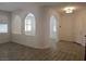 Open hallway with decorative arches, tile floors, and natural lighting at 11298 Corsica Mist Ave, Las Vegas, NV 89135