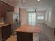 Open kitchen with stainless appliances, granite counters, and access to living area at 11298 Corsica Mist Ave, Las Vegas, NV 89135