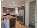 Spacious kitchen with an island, stainless steel appliances, and ample storage at 11298 Corsica Mist Ave, Las Vegas, NV 89135