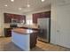 Beautiful kitchen features stainless steel appliances and a center island at 11298 Corsica Mist Ave, Las Vegas, NV 89135