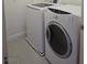 A clean laundry room with a modern washer and dryer at 11298 Corsica Mist Ave, Las Vegas, NV 89135