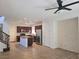 Open-concept living room and kitchen with modern fixtures and design at 11298 Corsica Mist Ave, Las Vegas, NV 89135