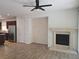 Spacious living room with a fireplace, tile flooring, and natural light at 11298 Corsica Mist Ave, Las Vegas, NV 89135