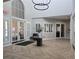 Bright lobby with high ceilings, modern lighting, stylish tile flooring, and elegant entryway at 11298 Corsica Mist Ave, Las Vegas, NV 89135