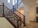Elegant staircase with decorative iron railing and plush carpet at 11298 Corsica Mist Ave, Las Vegas, NV 89135
