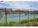 Well-maintained community tennis courts surrounded by lush greenery and neighborhood homes at 11298 Corsica Mist Ave, Las Vegas, NV 89135