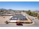 Aerial view of a one-story house with a dark gray roof and a red pickup truck nearby at 1227 San Gabriel Ave, Henderson, NV 89002