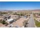 Expansive aerial view of desert home, showcasing a well-laid out neighborhood, desert, and mountains at 1227 San Gabriel Ave, Henderson, NV 89002