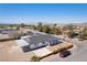 Aerial view showcasing a beautiful home, desert landscaping, and mountain views at 1227 San Gabriel Ave, Henderson, NV 89002