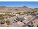 Expansive aerial view of desert home, showcasing its modern design and stunning mountain backdrop at 1227 San Gabriel Ave, Henderson, NV 89002