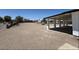 Large, open backyard with gravel landscaping and a covered patio, perfect for outdoor activities and entertaining at 1227 San Gabriel Ave, Henderson, NV 89002
