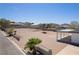 Property featuring a vacant backyard with block wall fencing and desert landscaping at 1227 San Gabriel Ave, Henderson, NV 89002