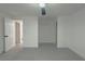 Bright bedroom showcasing new light gray flooring, ceiling fan, and a clean, modern aesthetic at 1227 San Gabriel Ave, Henderson, NV 89002