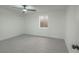 Bright bedroom showcasing new light gray flooring, ceiling fan, and a clean, modern aesthetic at 1227 San Gabriel Ave, Henderson, NV 89002