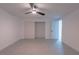 Bright bedroom showcasing new light gray flooring, ceiling fan, and a clean, modern aesthetic at 1227 San Gabriel Ave, Henderson, NV 89002