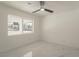 Clean bedroom with marble floors, a ceiling fan, and a large window showcasing the outdoors at 1227 San Gabriel Ave, Henderson, NV 89002