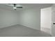 Bright bedroom showcasing new light gray flooring, ceiling fan, and a clean, modern aesthetic at 1227 San Gabriel Ave, Henderson, NV 89002