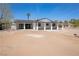 Rear exterior view of updated single-story home with a covered patio and desert landscaping at 1227 San Gabriel Ave, Henderson, NV 89002