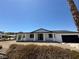 Charming single-story home with a covered porch, black trim, and an attached garage at 1227 San Gabriel Ave, Henderson, NV 89002