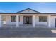 Charming single-story home featuring a decorative front door and covered porch with supporting columns at 1227 San Gabriel Ave, Henderson, NV 89002