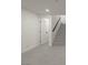 Hallway featuring new light gray flooring, modern baseboards, and a clean, bright aesthetic at 1227 San Gabriel Ave, Henderson, NV 89002