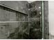 Modern walk-in shower featuring dark tile, mosaic accents, and sleek fixtures at 1227 San Gabriel Ave, Henderson, NV 89002