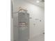 Water heater in the utility room with white walls and marble tile flooring at 1227 San Gabriel Ave, Henderson, NV 89002