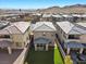 Aerial view of a modern home with artificial turf backyard in a well-planned community at 12525 Lylan Ridge St, Las Vegas, NV 89138
